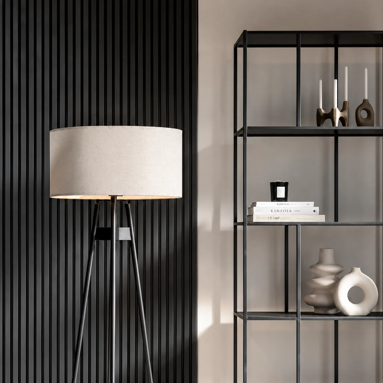 Black acoustic slat wall with floor lamp and shelving