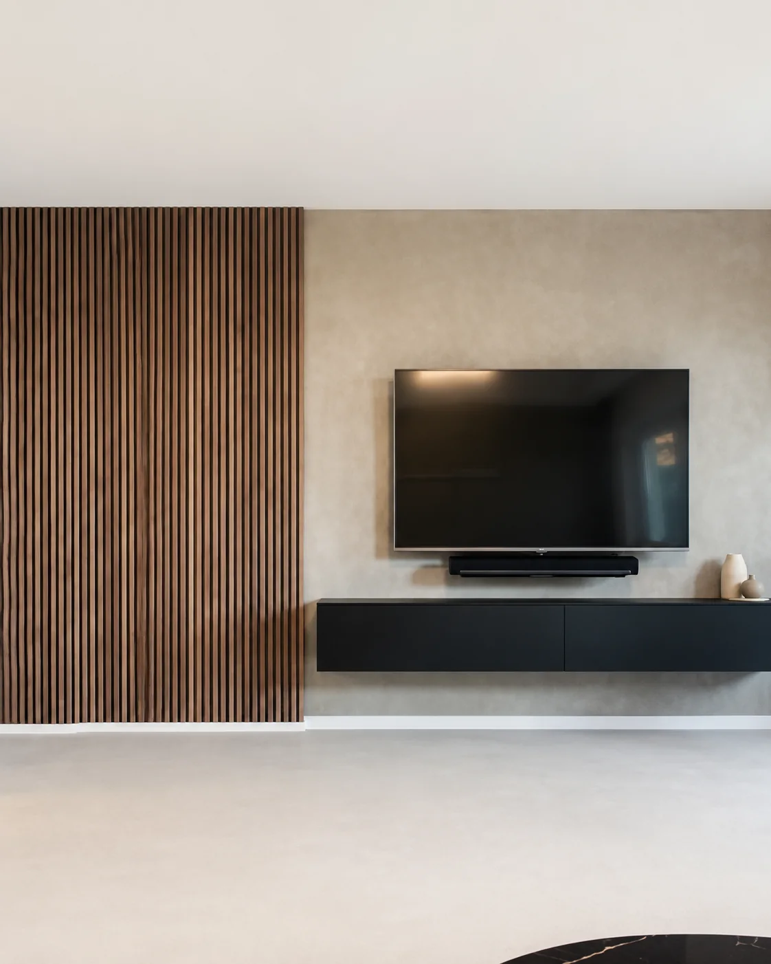 Walnut slat feature wall beside wall-mounted television